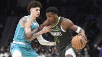 Minnesota Timberwolves guard Anthony Edwards (5) drives past Charlotte Hornets guard LaMelo Ball (1) during the second half at the Spectrum Center.