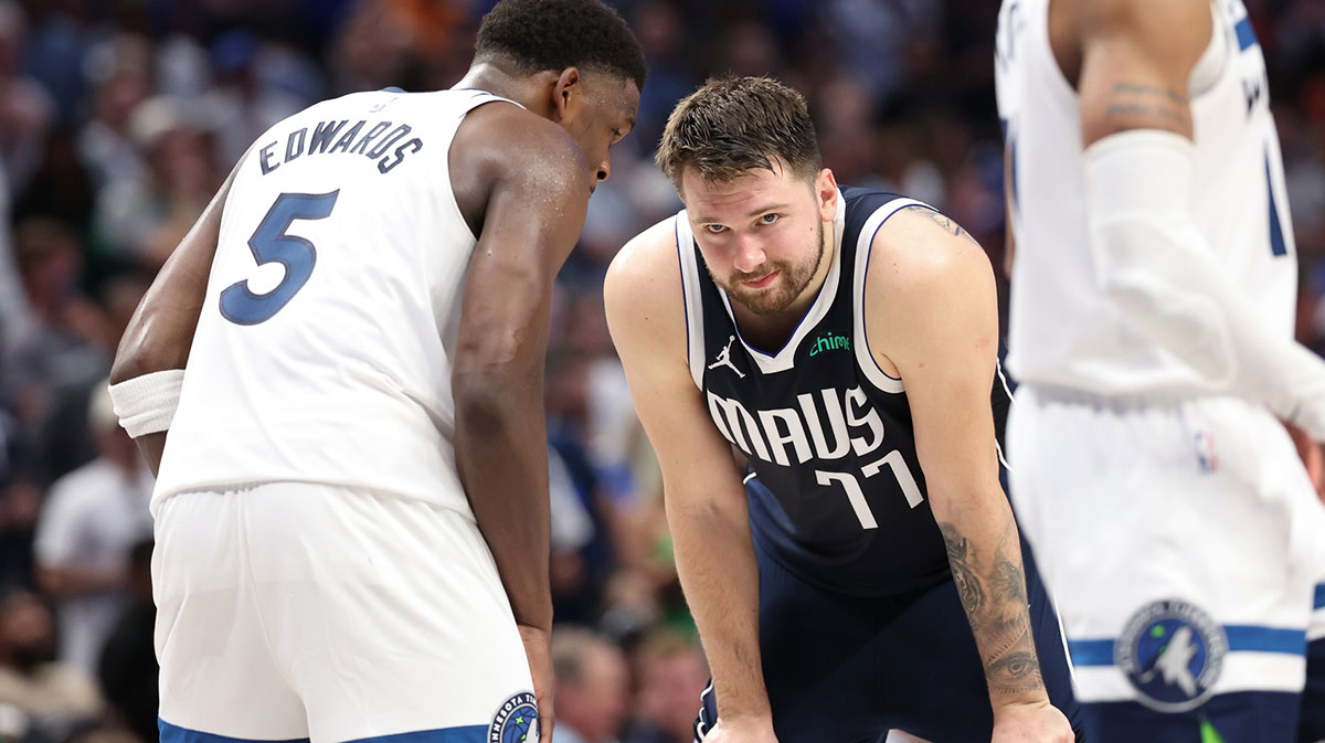 Minnesota Timbervolves Guard Anthoni Edwards (5) speaks to Dallas Mavericks Guard Luka Doncic (77) during the fourth quarter of the Games for the Western Conference for Playoffs in American Airlines.