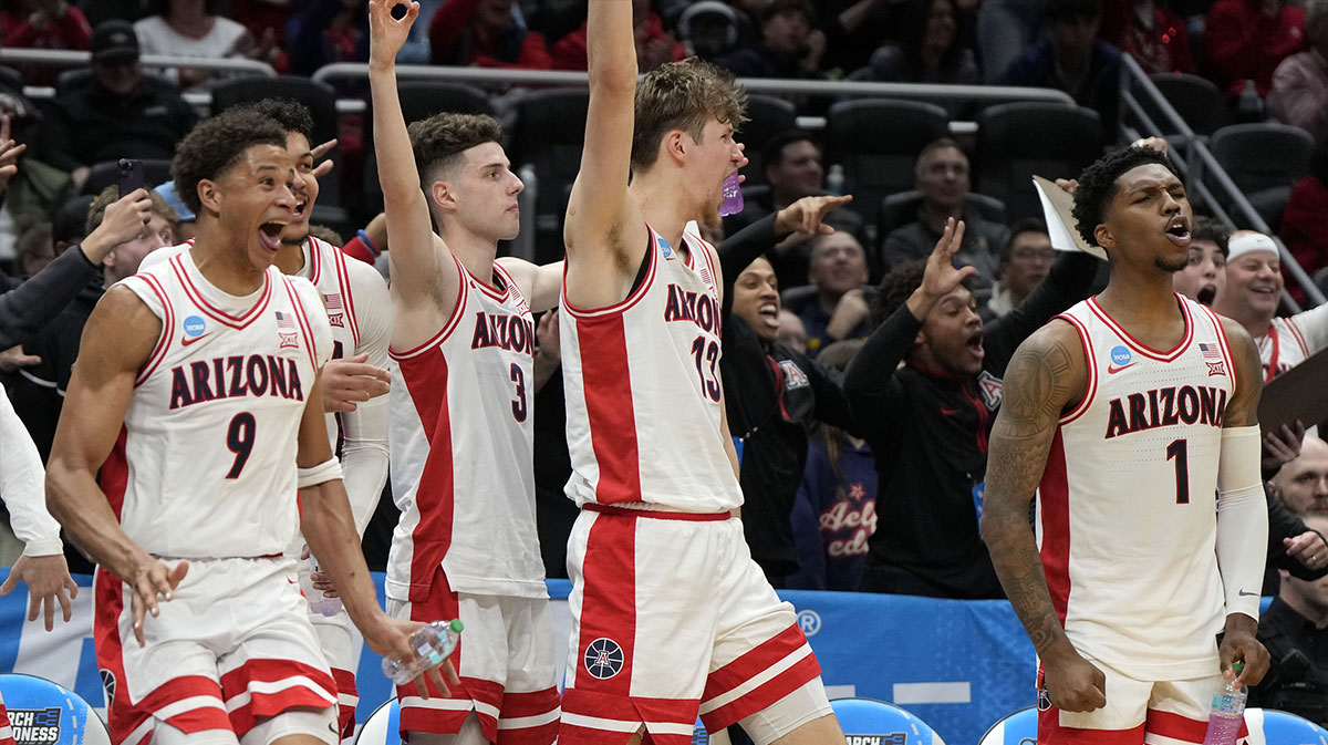 Arizona Wildcats forward Carter Bryant (9), guard Anthony Dell'Orso (3), forward Henri Veesaar (13) and guard Caleb Love (1) react on the bench against the Akron Zips during the second half in the first round of the NCAA Tournament at Climate Pledge Arena.