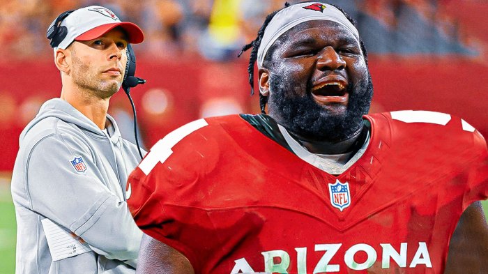 Arizona Cardinals head coach Jonathan Gannon with Dalvin Tomlinson in a Cardinals uniform as the cardinals added Tomlinson in free agency to improve the defensive line.