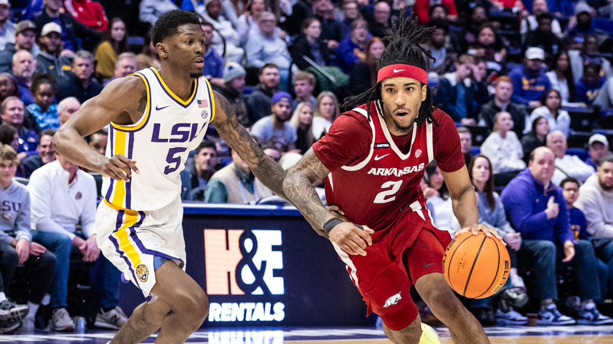 Arkansas Razorbacks guard Boogie Fland (2) against LSU Tigers guard Cam Carter (5) during the second half at Pete Maravich Assembly Center.