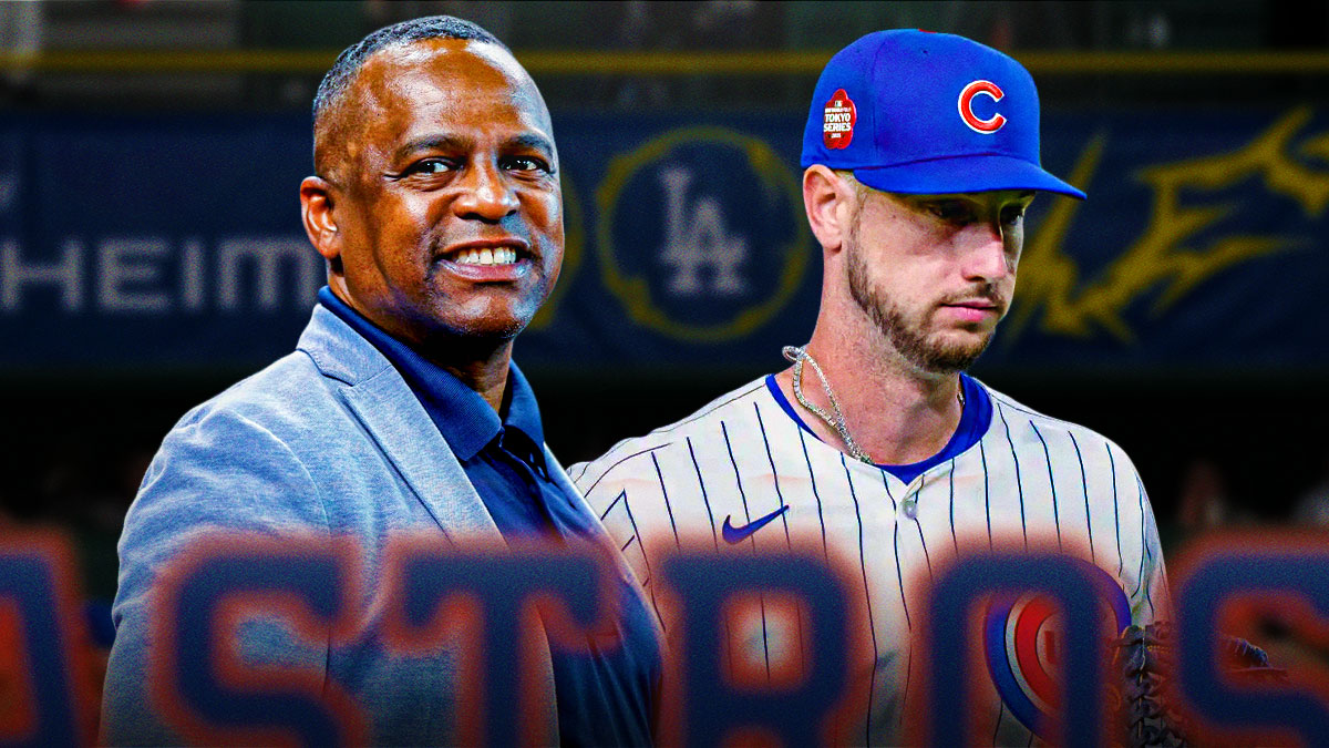 Astros general manager Dana Brown with Kyle Tucker in a Cubs jersey next to him