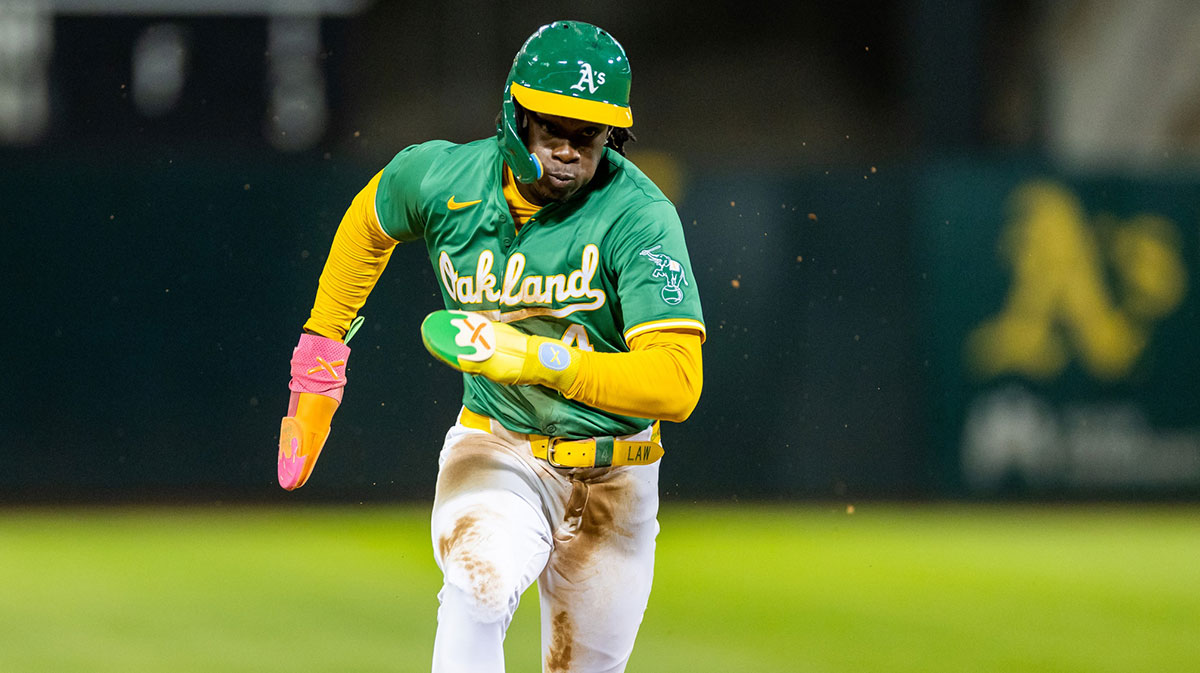 Oakland Athletics outfielder Lawrence Butler (4) runs to third during the fourth inning against the New York Yankees at Oakland-Alameda County Coliseum.