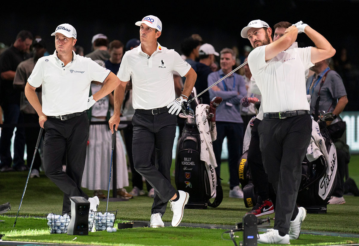 Justin Thomas, left, Billy Horschel and Patrick Cantlay, right, of Atlanta Drive GC warm up for match against Bay Club Golf in the TGL semifinal match