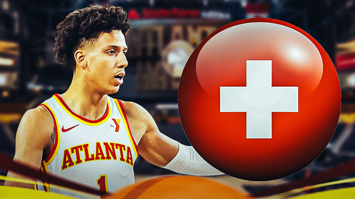 Hawks Jalen Johnson with a medical red cross next to him