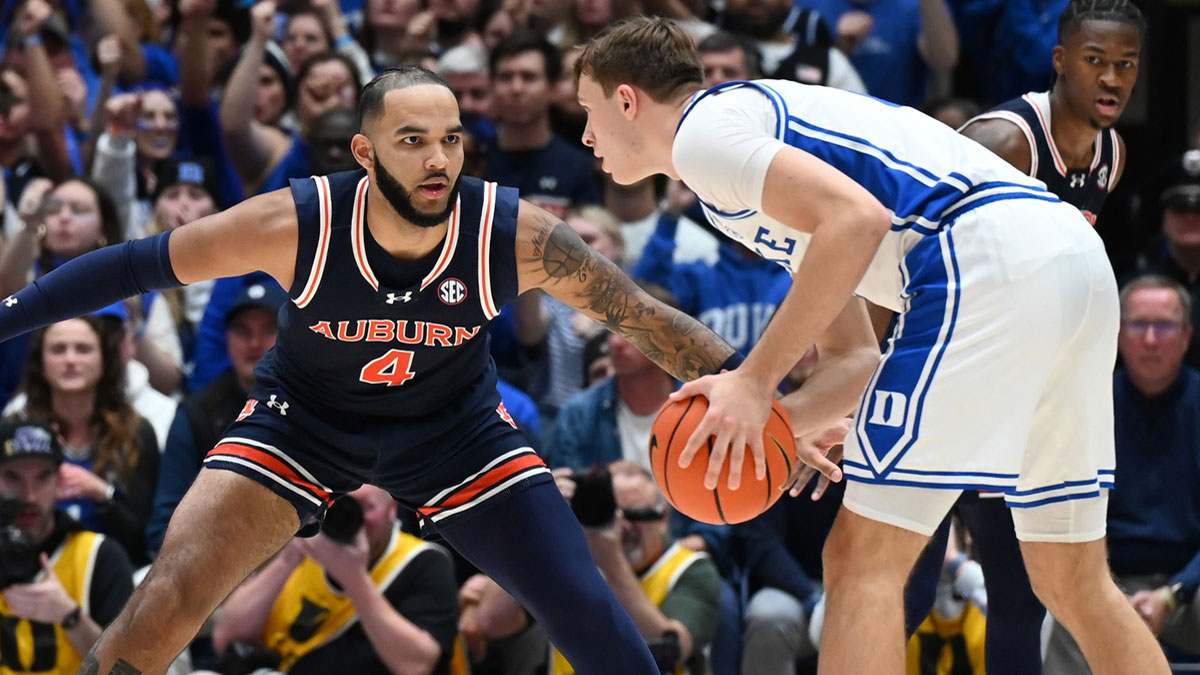 Duke Blue Devils forward Cooper Flagg (2) controls the ball in front of Auburn Tigers center Johni Broome (4) during the first half at Cameron Indoor Stadium. 