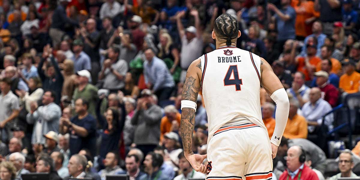 Auburn Tigers forward Johni Broome (4) yells to the crowd against the Mississippi Rebels during the second half at Bridgestone Arena.