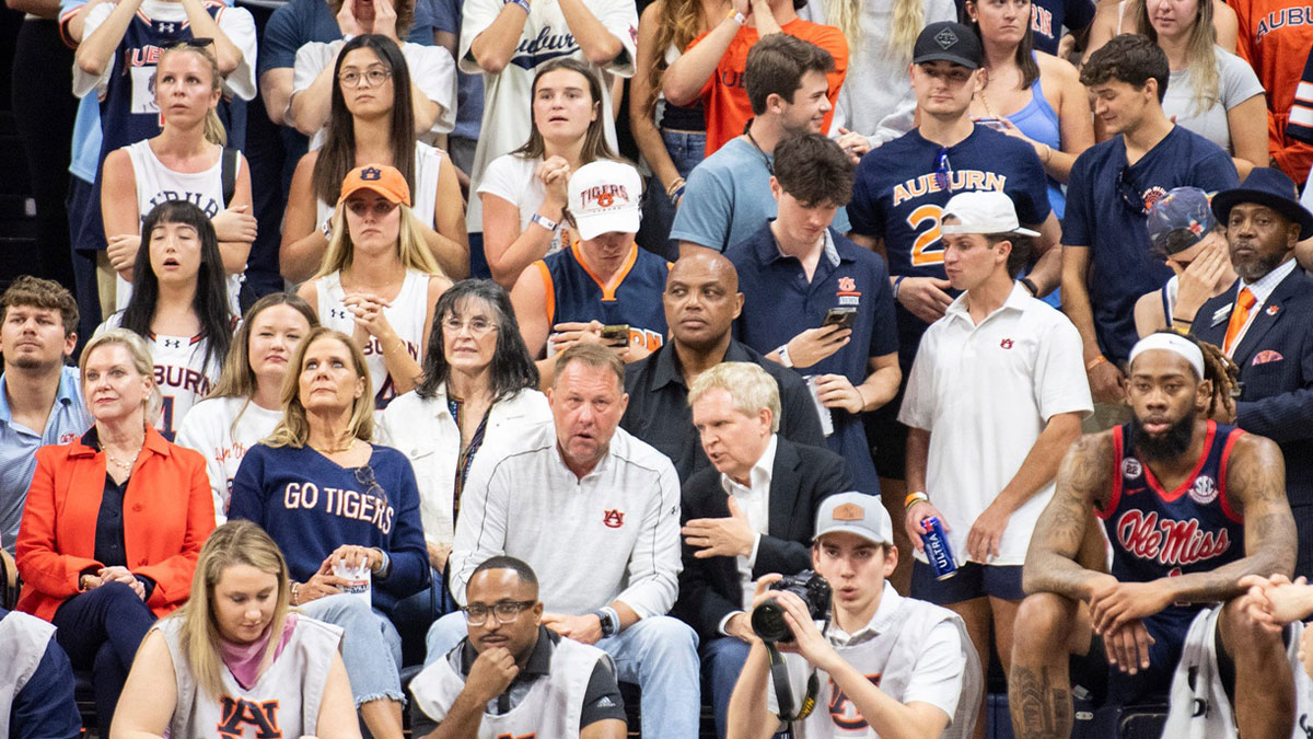 Former Auburn and NBA player Charles Barkley, Auburn football coach Hugh Freeze and Bill Neville take in the game as Auburn Tigers take on Ole Miss Rebels at Neville Arena in Auburn, Ala., on Wednesday, Feb. 26, 2025.