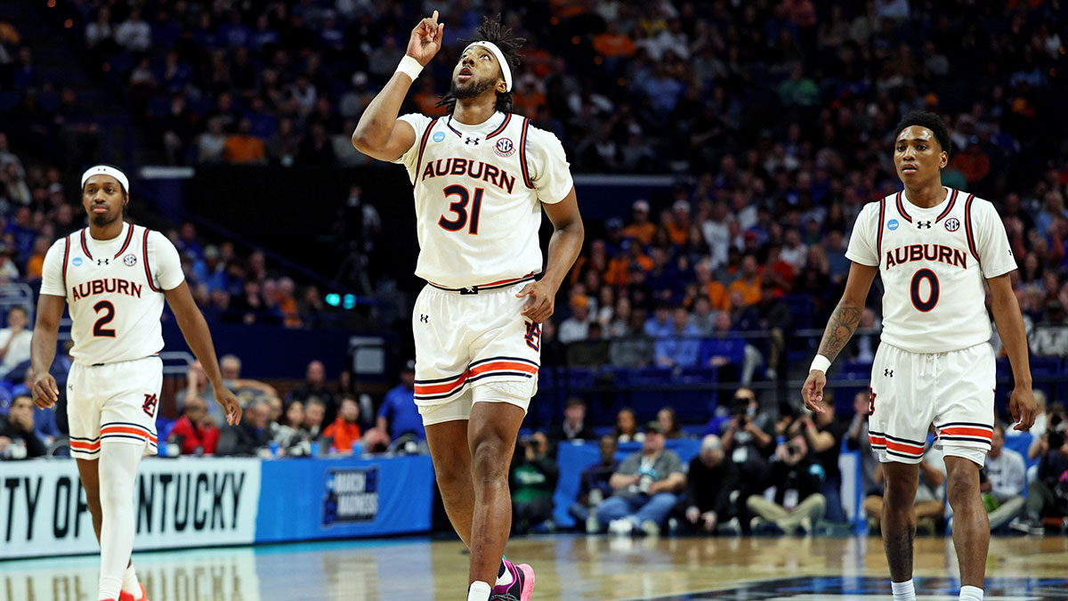 Auburn Tigers forward Chaney Johnson (31) celebrates after a play during the first half against the Creighton Bluejays in the second round to the NCAA Tournament at Rupp Arena.
