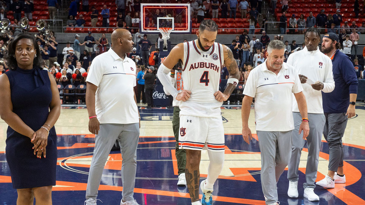 Auburn Tigers forward Johni Broome (4) and head coach Bruce Pearl leave the court after the game as Auburn Tigers take on Alabama Crimson Tide at Neville Arena in Auburn, Ala., on Saturday, March 8, 2025. Alabama Crimson Tide defeated Auburn Tigers 93-91 in overtime.