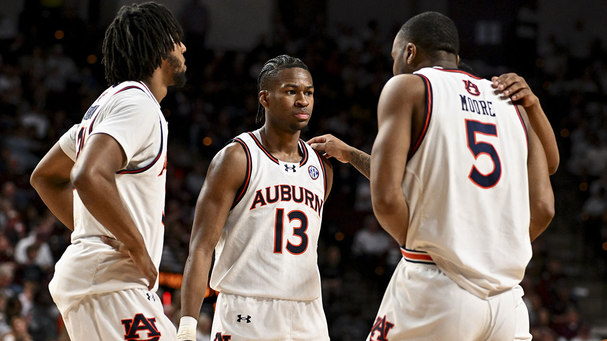 Auburn Tigers guard Miles Kelly (13) and teammates huddle up during a time-out during the second half against the Texas A&M Aggies at Reed Arena.
