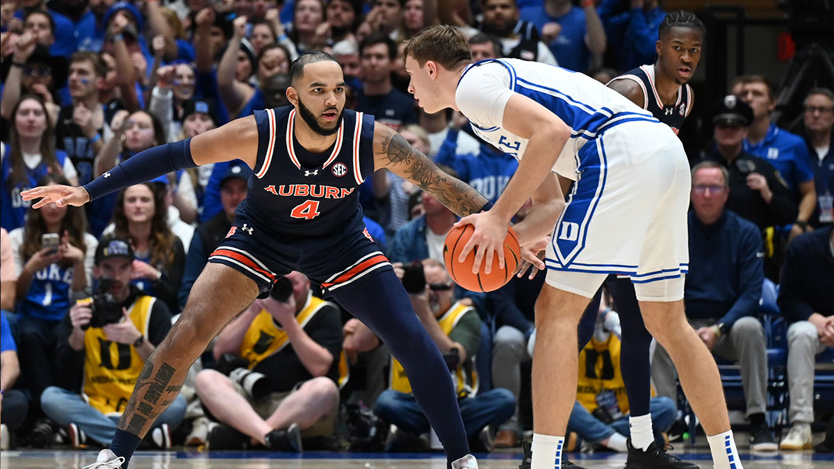 Duke Blue Devils forward Cooper Flagg (2) controls the ball in front of Auburn Tigers center Johni Broome (4) during the first half at Cameron Indoor Stadium.