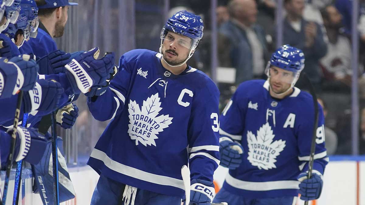 Toronto Maple Leafs forward Auston Matthews (34) gets congratulated after scoring against the Colorado Avalanche on an assist by Toronto Maple Leafs forward John Tavares (91) during the second period at Scotiabank Arena.