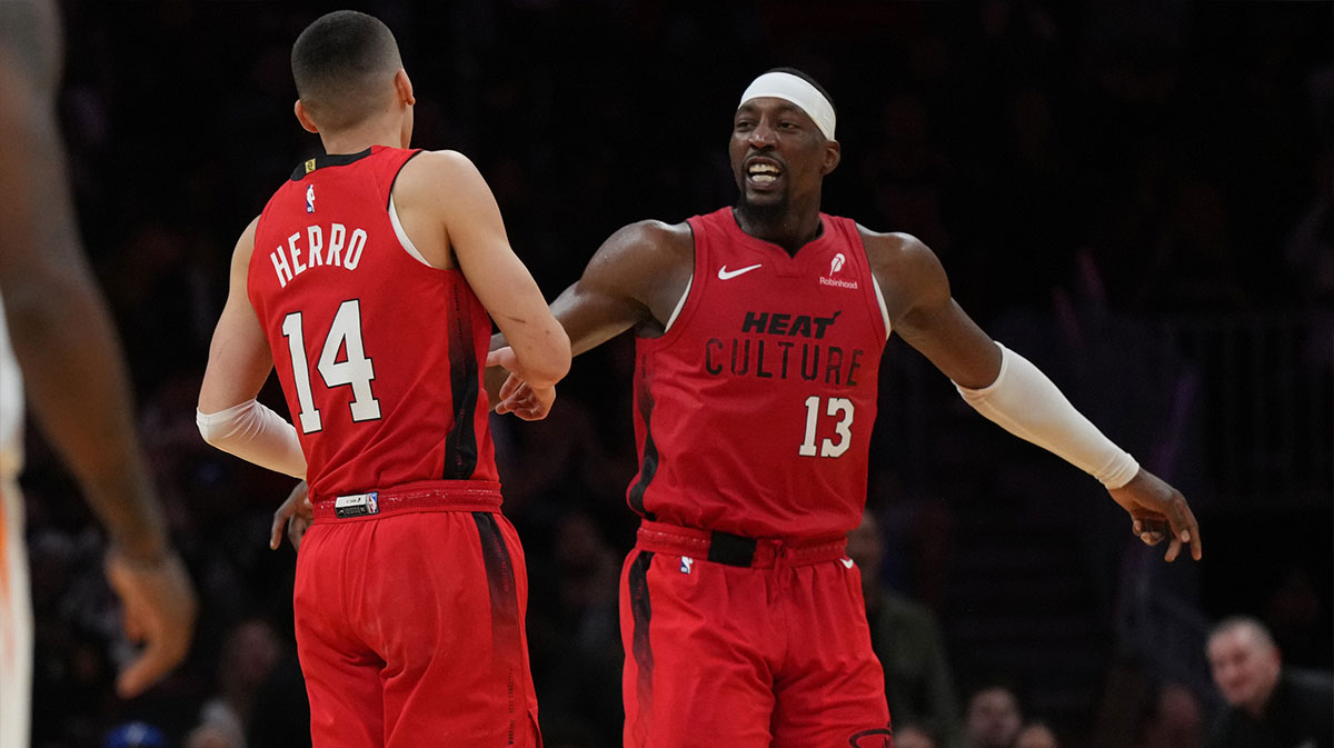 Miami heat center Bam Adebaiio (13) celebrates with guard Tyler Herro (14), after Herro indicated a basket in points in relation to the sunshine during the second half in the center of Kaseya. 