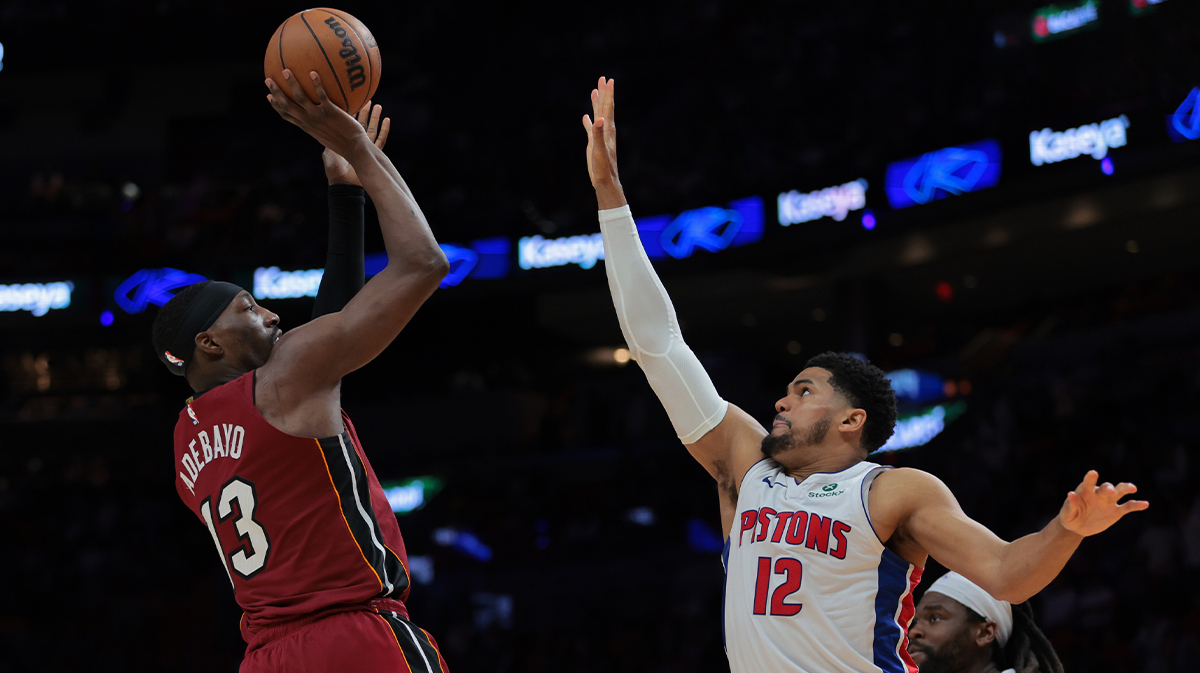 Miami Heat Center Bam Adebaiio (13) shoots in basketball through detroit pistons forward tobias Harris (12) during the second quarter in the Kaseya Center.