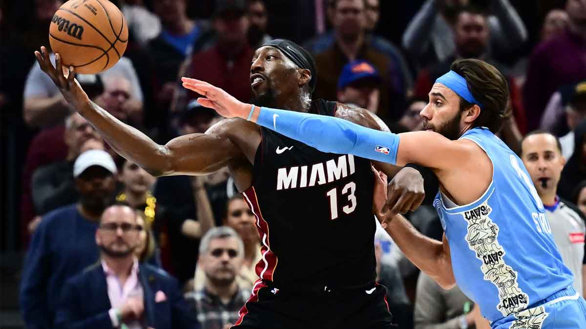 Cleveland Cavaliers guard Max Strus (1) defends Miami Heat center Bam Adebayo (13) during the second half at Rocket Arena.