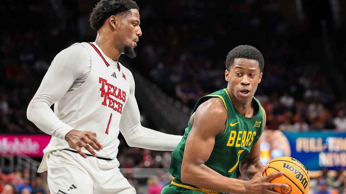 Baylor Bears guard VJ Edgecombe (7) drives to the basket around Texas Tech Red Raiders guard Kevin Overton (1) during the second half at T-Mobile Center.
