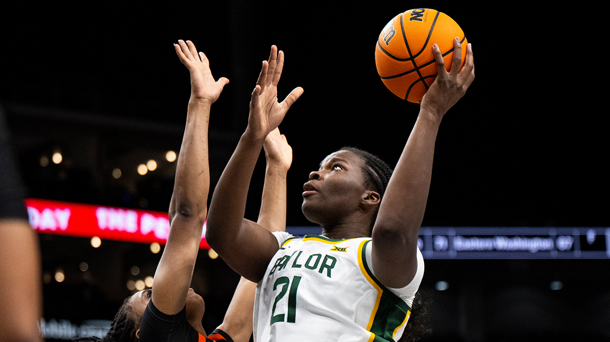 Baylor Lady Bears center Aaronette Vonleh (21) shoots the ball while defended by Oklahoma State Cowgirls forward Praise Egharevba (24) during the first half.