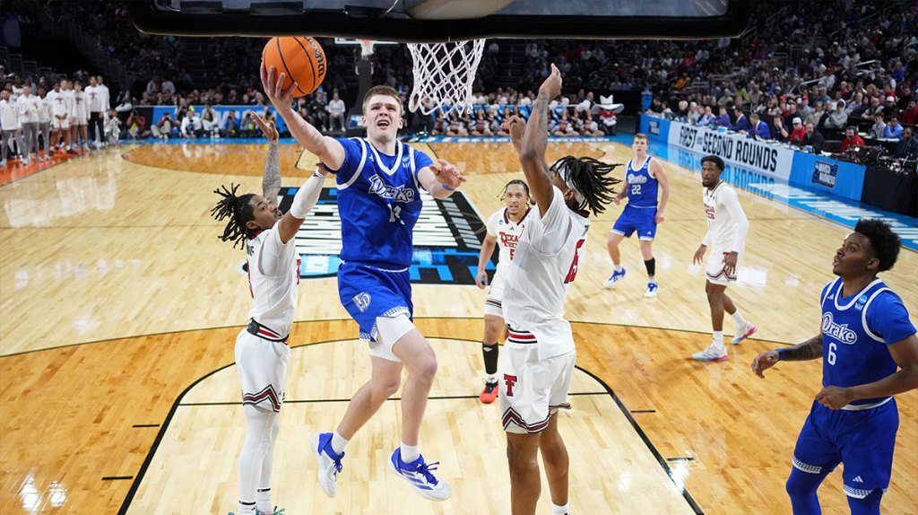 Drake Bulldogs guard Bennett Stirtz (14) shoots the ball against Texas Tech Red Raiders guard Elijah Hawkins (3) and forward JT Toppin (15) during the second half at Intrust Bank Arena.