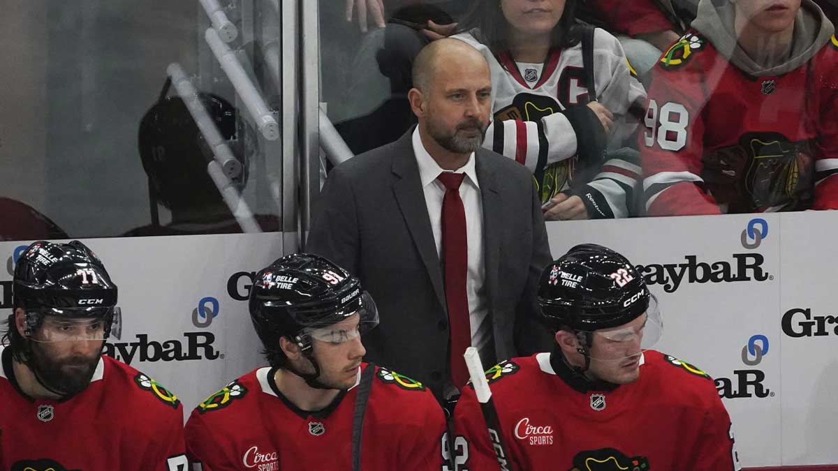 Chicago Blackhawks interim head coach Anders Sorensen stands behind the bench during the third period of the game against the Seattle Kraken at United Center