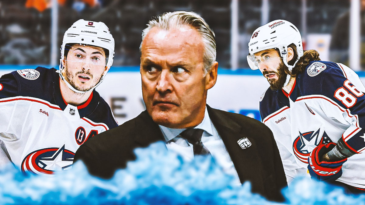 Dean Evason in middle looking stern, Zach Werenski and Kirill Marchenko on either side looking stern, hockey rink in background
