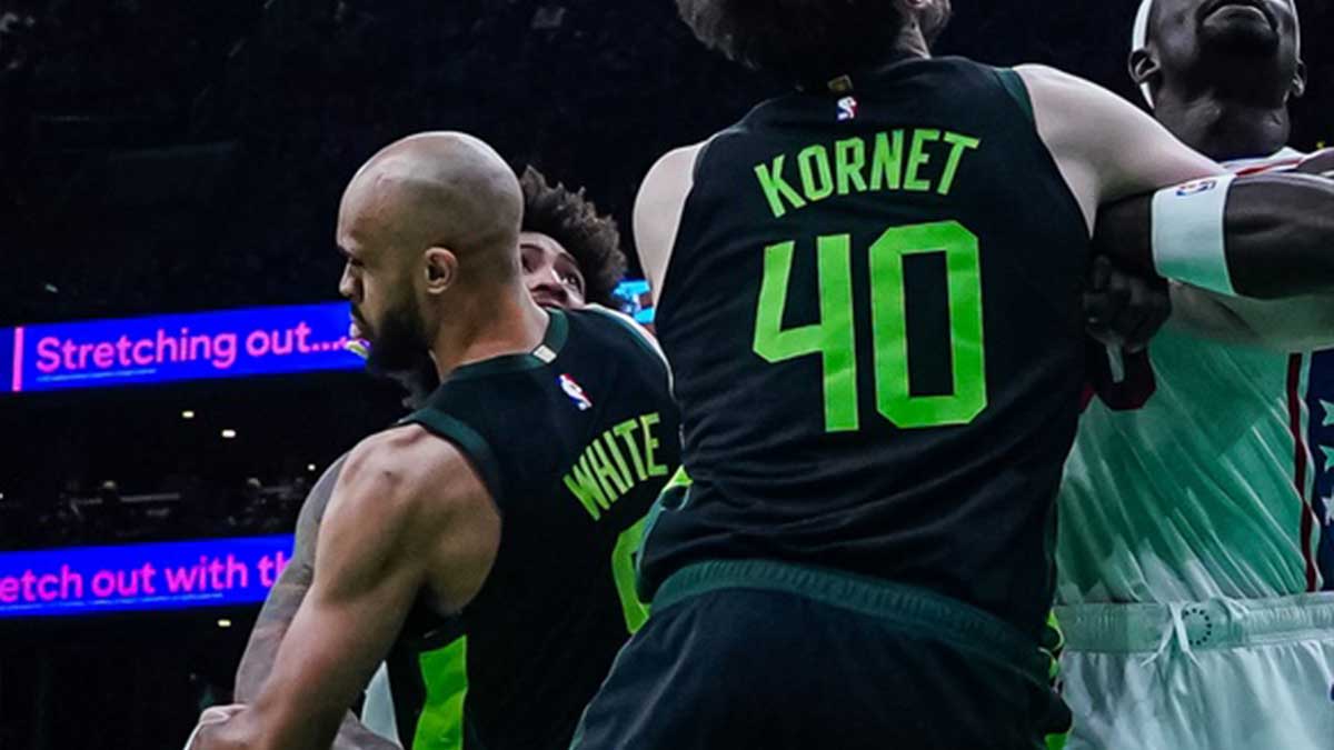 Boston Celtics guard Derrick White (9) appears to have lost a tooth as they take on the Philadelphia 76ers in the second quarter at TD Garden.