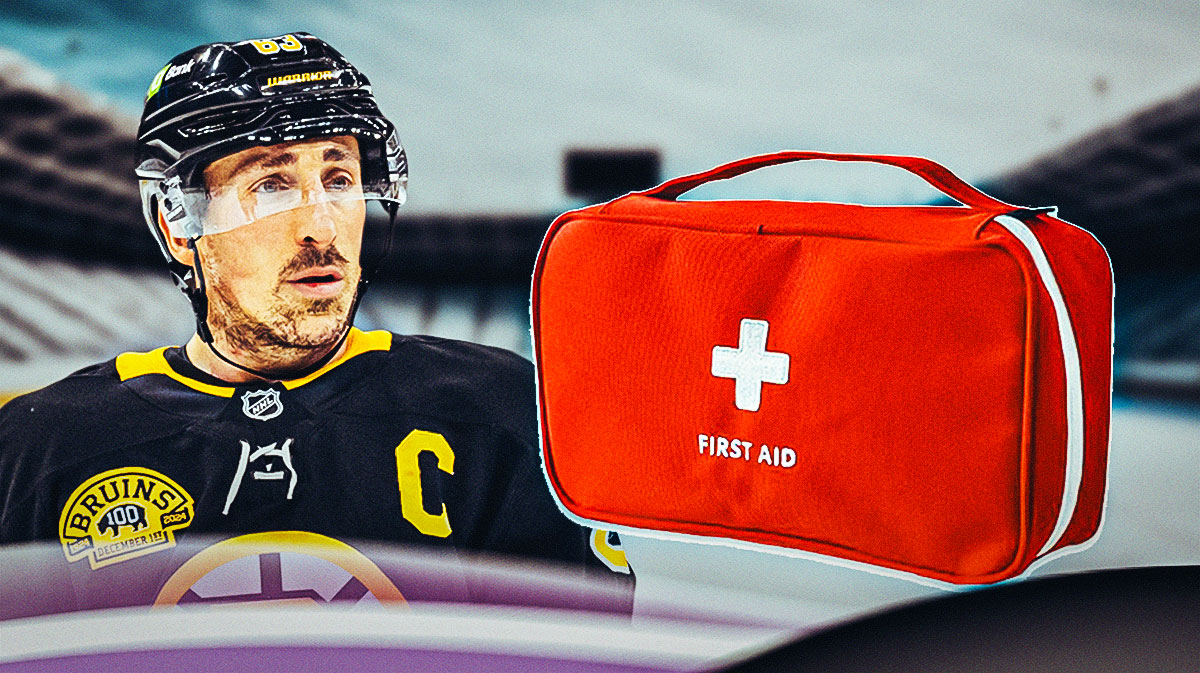 Brad Marchand looking stern, first aid kit, hockey rink in background