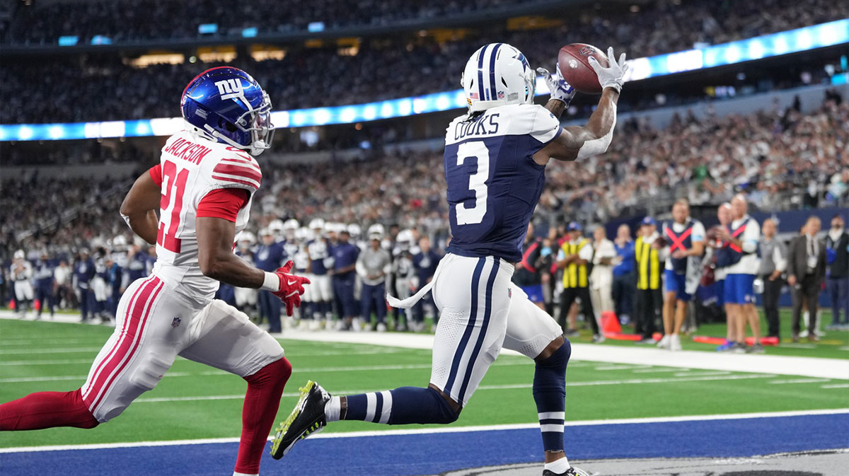 Nov 28, 2024; Arlington, Texas, USA; Dallas Cowboys wide receiver Brandin Cooks (3) makes a touchdown catch against New York Giants cornerback Adoree' Jackson (21) during the second half at AT&T Stadium. 