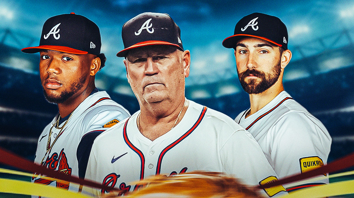Atlanta Braves manager Brian Snitker in the middle with Ronald Acuna Jr. and Spencer Strider on either side in front of Truist Park.