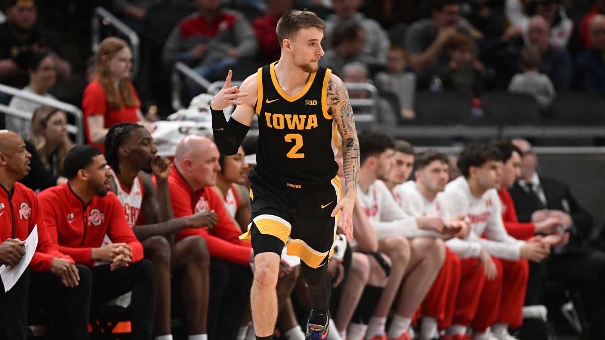 Iowa Hawkeyes guard Brock Harding (2) celebrates after making a three-point basket during the first half against the Ohio State Buckeyes at Gainbridge Fieldhouse.
