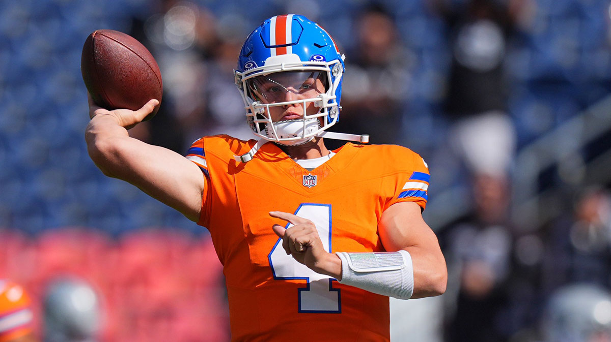 Denver Broncos quarterback Zach Wilson (4) warms up before the game against the Las Vegas Raiders at Empower Field at Mile High. 