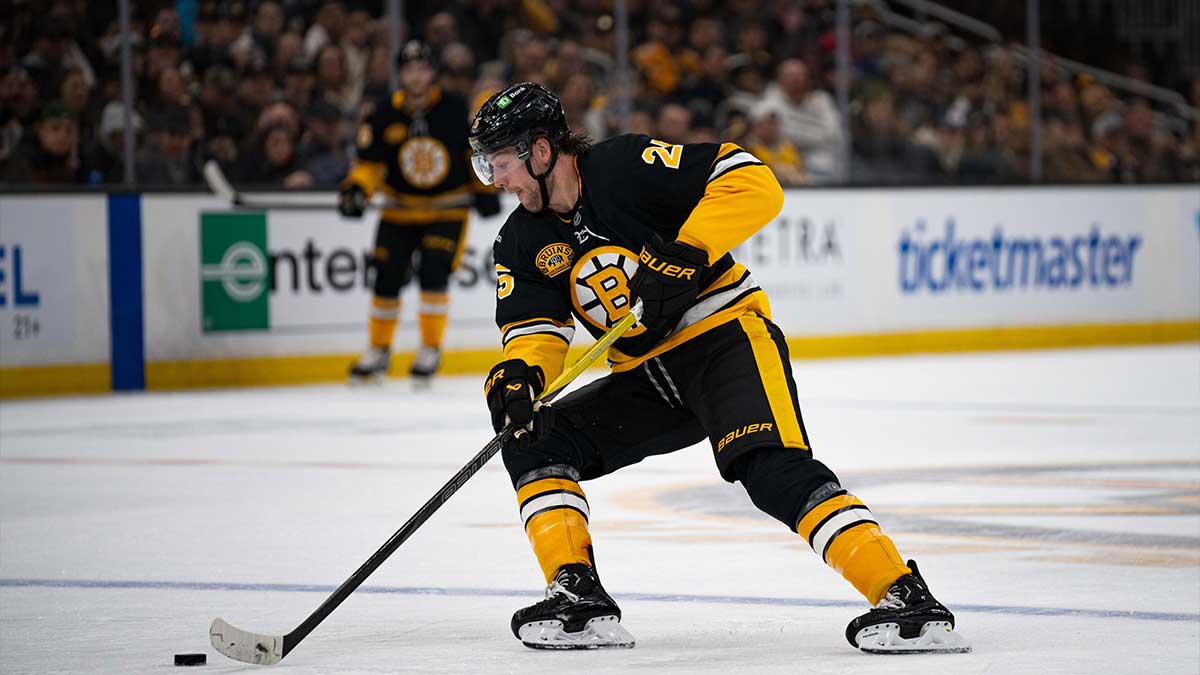 Boston Bruins defenseman Brandon Carlo (25) skates with the puck during the second period of a game against the Montreal Canadiens at TD Garden.