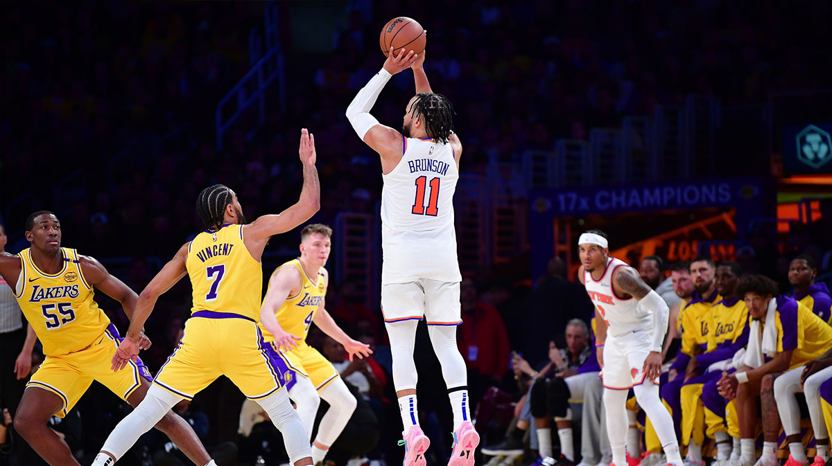 New York Knicks guard Jalen Brunson (11) shoots against Los Angeles Lakers guard Gabe Vincent (7) during the second half at Crypto.com Arena.