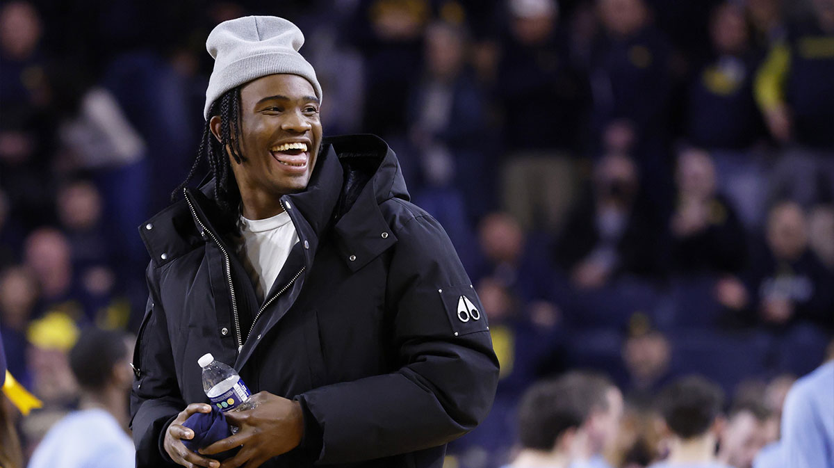 Michigan Wolverines quarterback Bryce Underwood participates in a t-shirt toss during a time out in the second half against the Penn State Nittany Lions at Crisler Center.