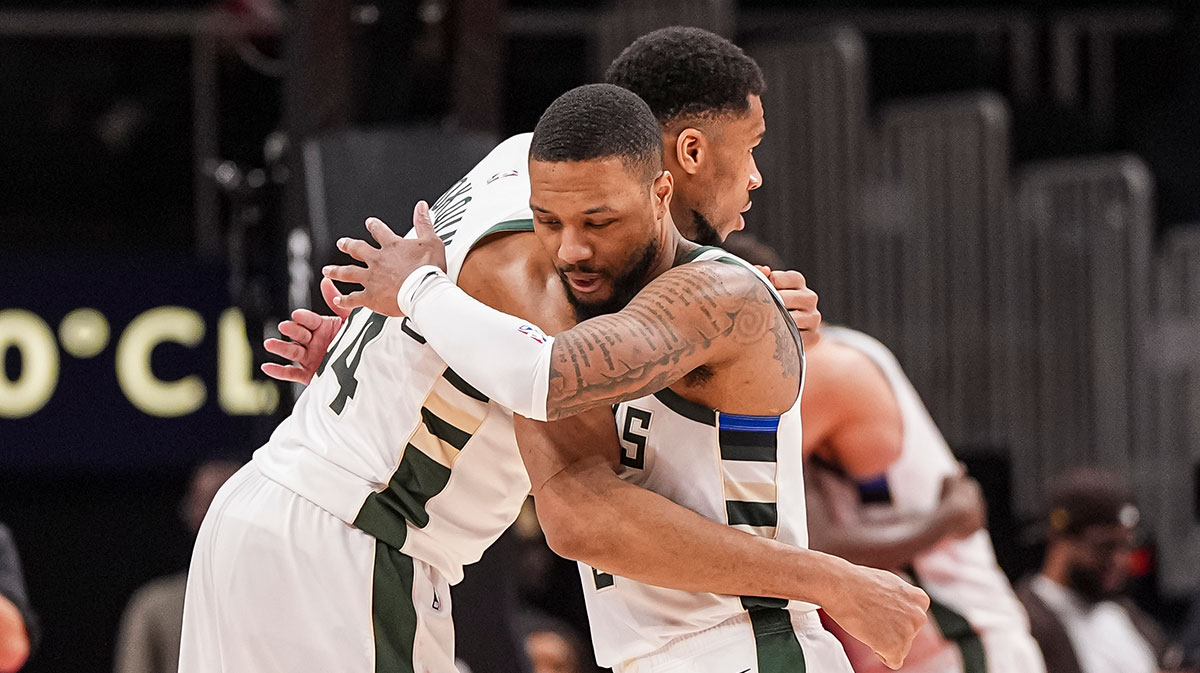 Bucks forward Giannis Antetokounpo (34) and Damian Lillard (0) guard after defeating Atlant Hawks on the State Farm Arena