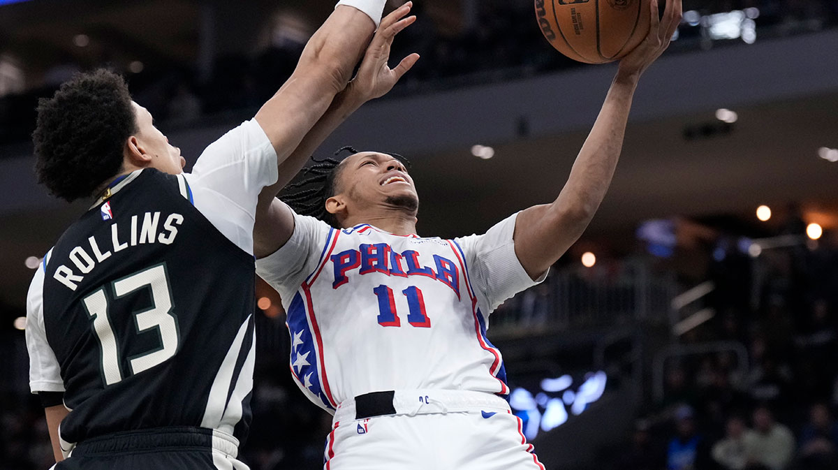 Philadelphia 76ers guard Jeff Dowtin Jr. (11) drives to the basket against Milwaukee Bucks guard Ryan Rollins (13) in the second half at Fiserv Forum.