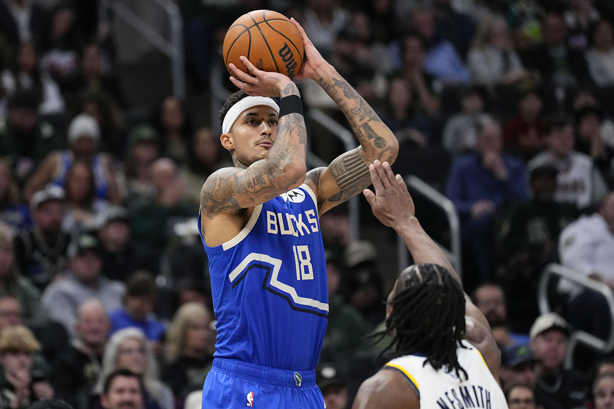 Bucks striker, Kyle Kuzma (18), shoots the pacers striker Indiana Aaron Nesmith (23) during the third quarter at Fiserv Forum