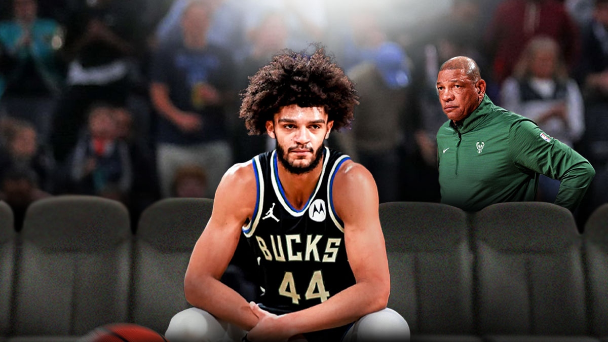 Andre Jackson Jr. sitting on the bench, perhaps with Doc Rivers next to him