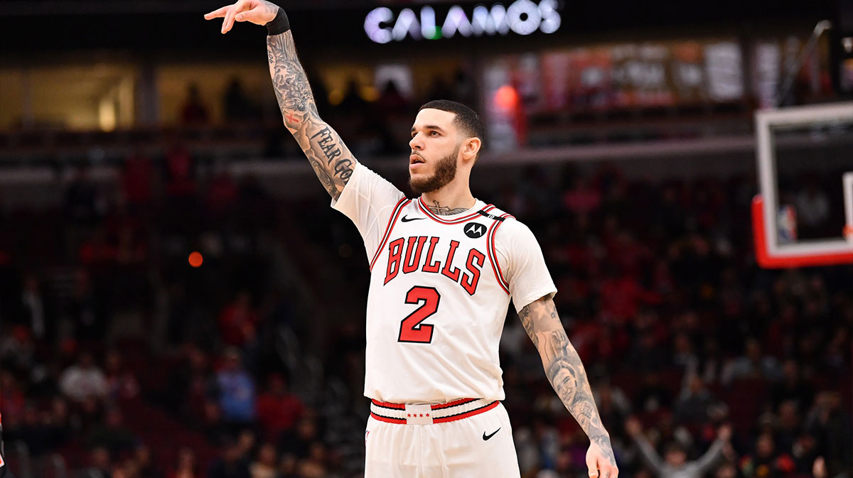 Bulls Forward Lonzo Ball (2) hit three points against Toronto Raptors Jamal Shead (23) during overtime in the United Center