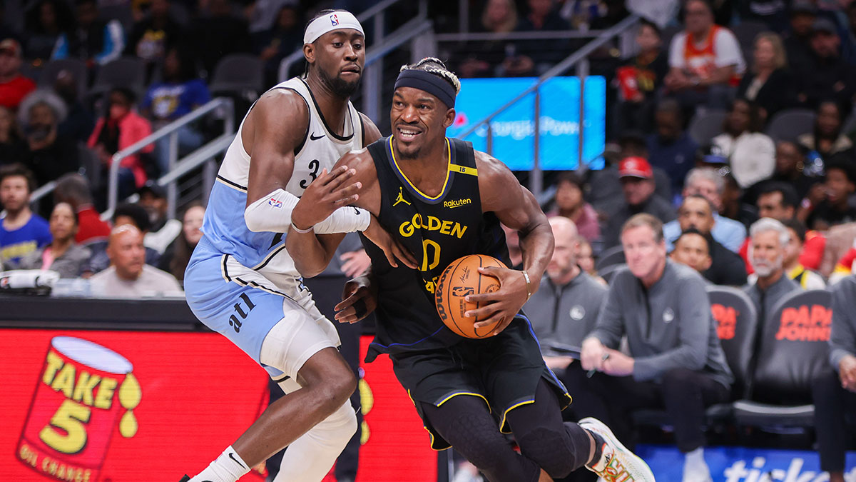 Golden State Warriors forward Jimmy Butler III (10) drives past Atlanta Hawks guard Caris LeVert (3) in the fourth quarter at State Farm Arena.