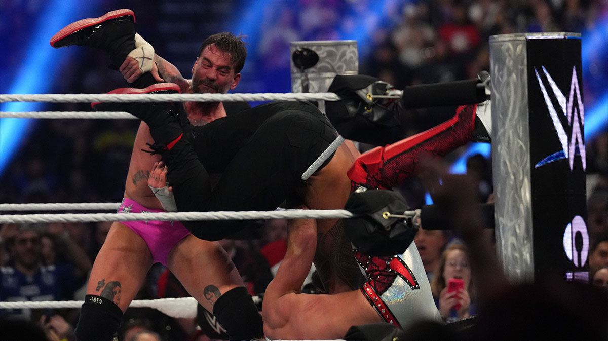 CM Punk eliminating Roman Reigns and Seth Rollins from the Royal Rumble on February 1, 2025.