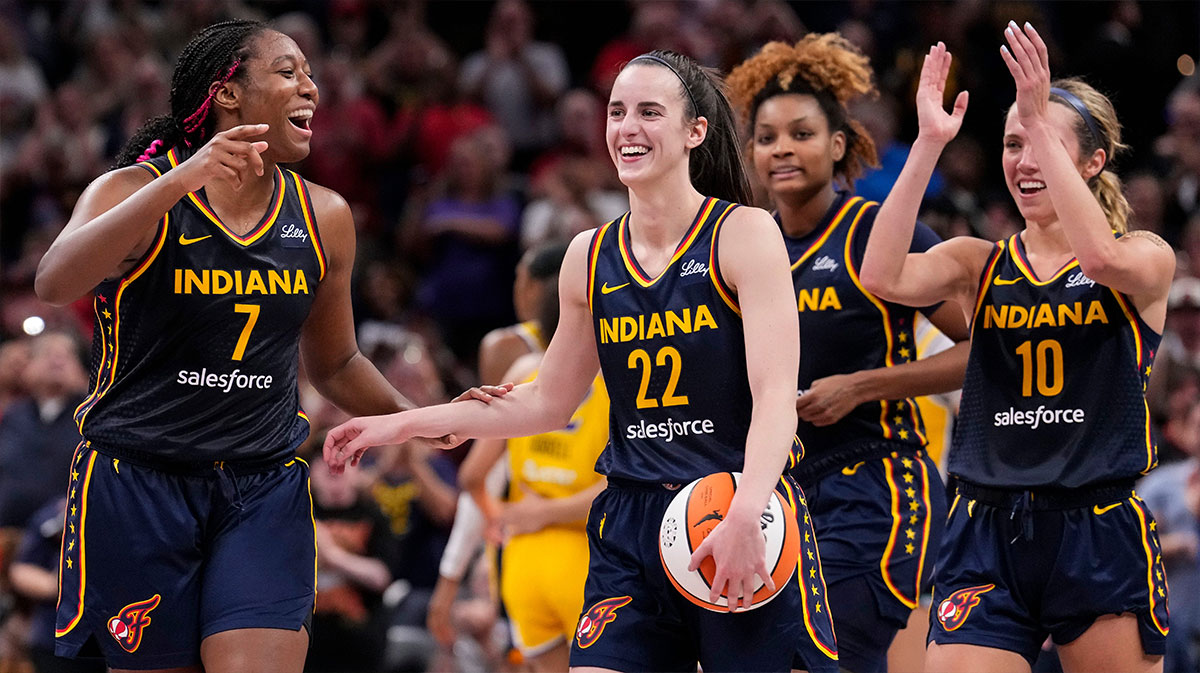 Indiana Fever forward Aliyah Boston (7) celebrates with Indiana Fever guards Caitlin Clark (22) and Lexie Hull (10) altering recording a triple-double Wednesday, Sept. 4, 2024, during the game at Gainbridge Fieldhouse in Indianapolis. The Indiana Fever defeated the Los Angeles Sparks, 93-86.