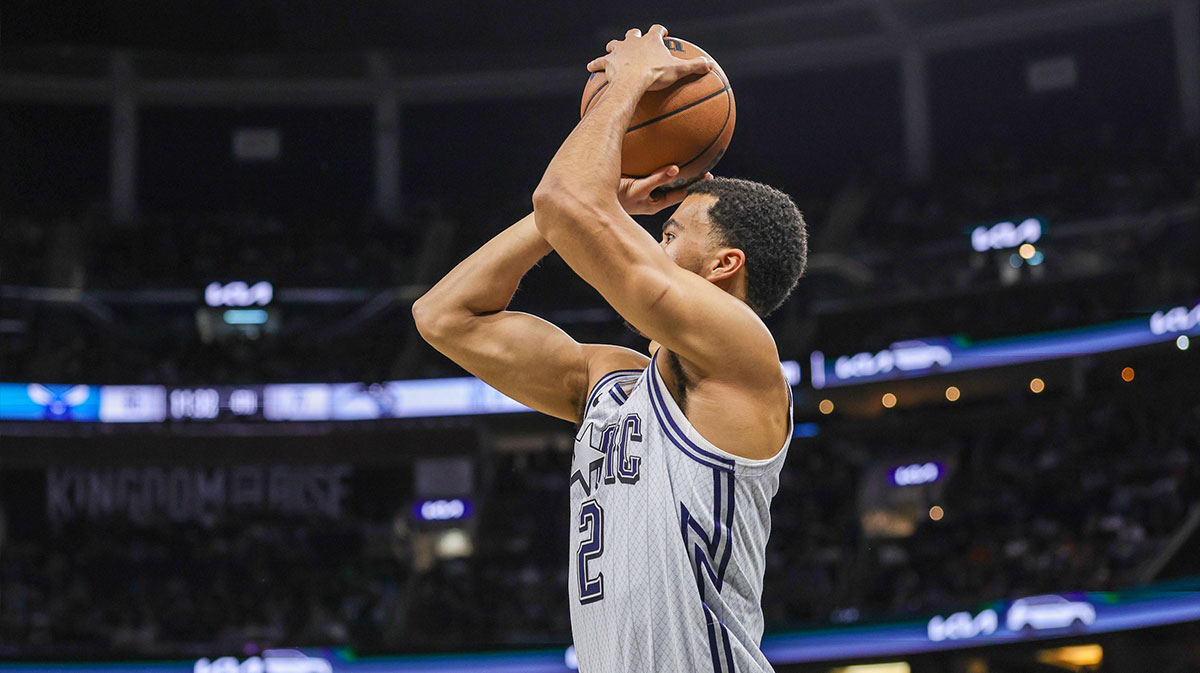 Orlando Magic Guard Caleb Houseban (2) Makes the ball a three-point basket during the second half against Charlotte Hornets in the Kia Center.