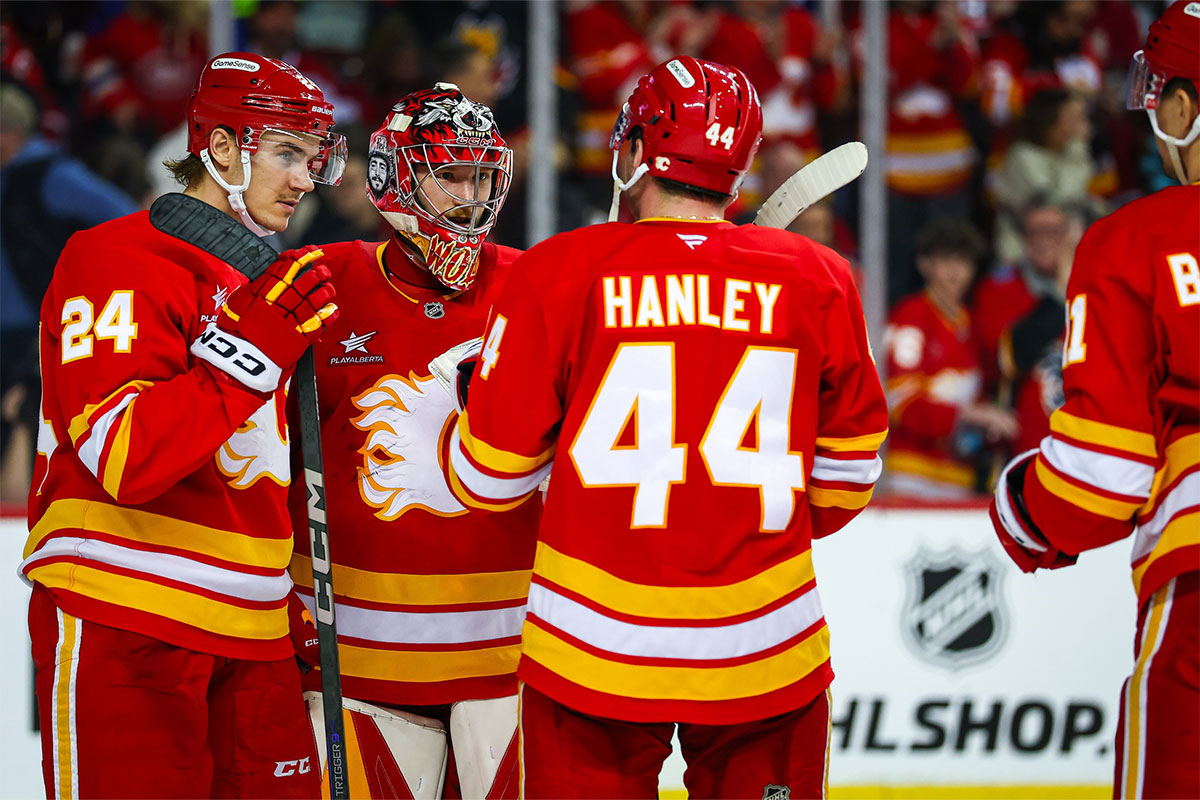 Calgary Flames goaltender Dustin Wolf (32) celebrate win with teammates after defeating Montreal Canadiens at Scotiabank Saddledome.