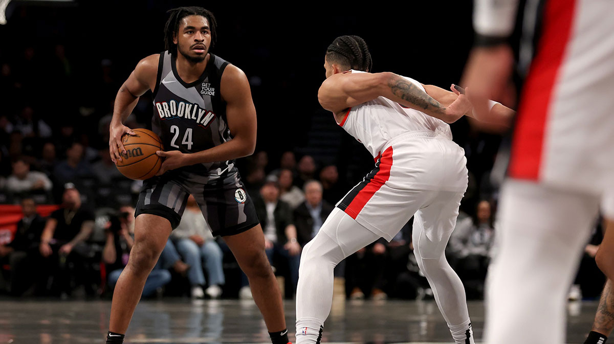 Brooklyn Nets guard Cam Thomas (24) controls the ball against Portland Trail Blazers forward Toumani Camara (33) during the first quarter at Barclays Center.