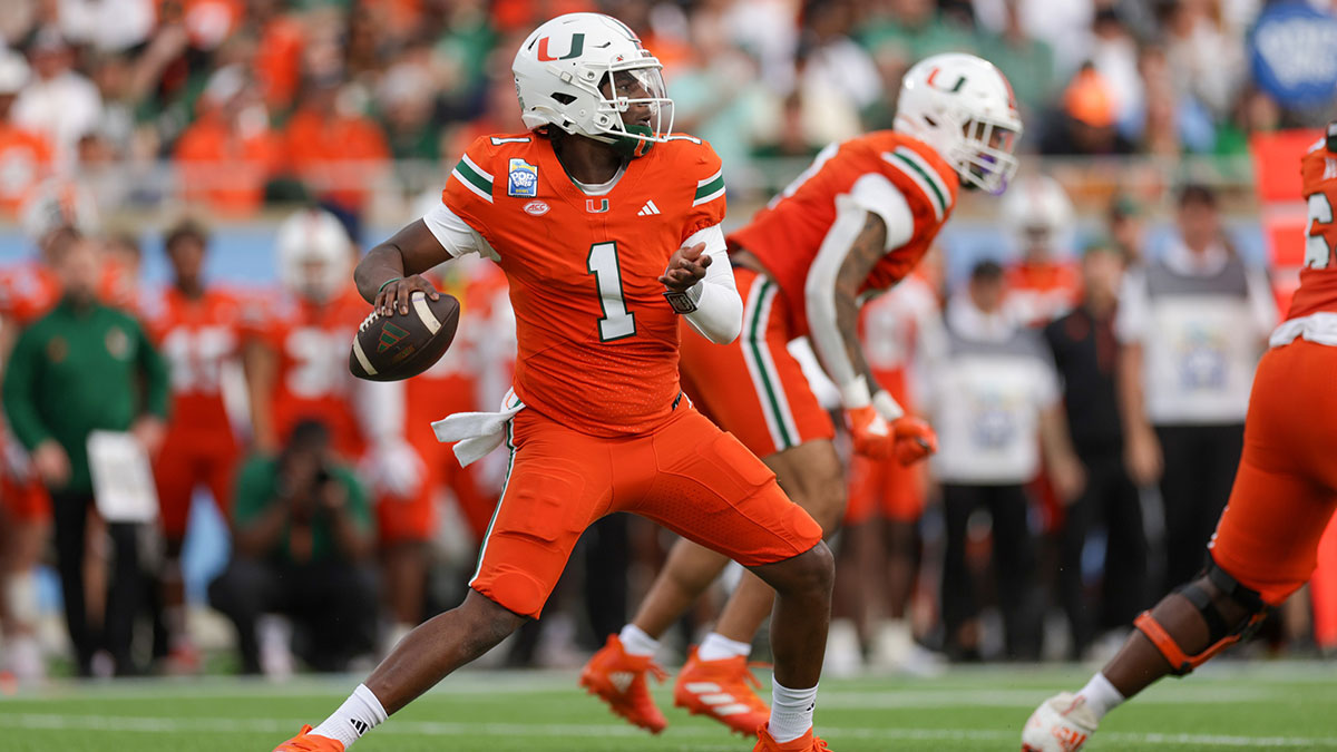 Dec 28, 2024; Orlando, FL, USA; Miami Hurricanes quarterback Cam Ward (1) drops back to pass against the Iowa State Cyclones in the first quarter during the Pop Tarts bowl at Camping World Stadium.