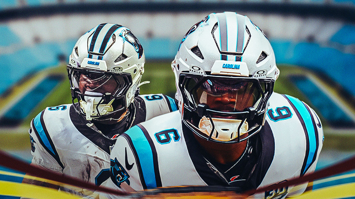 Panthers Miles Sanders running with a football.