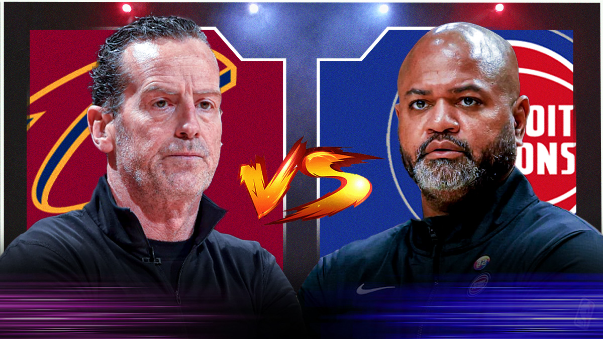 Kenny Atkinson and J.B. Bickerstaff staring each other down with a video game "VERSUS" in between them featuring a Cavs-Pistons-themed BG.