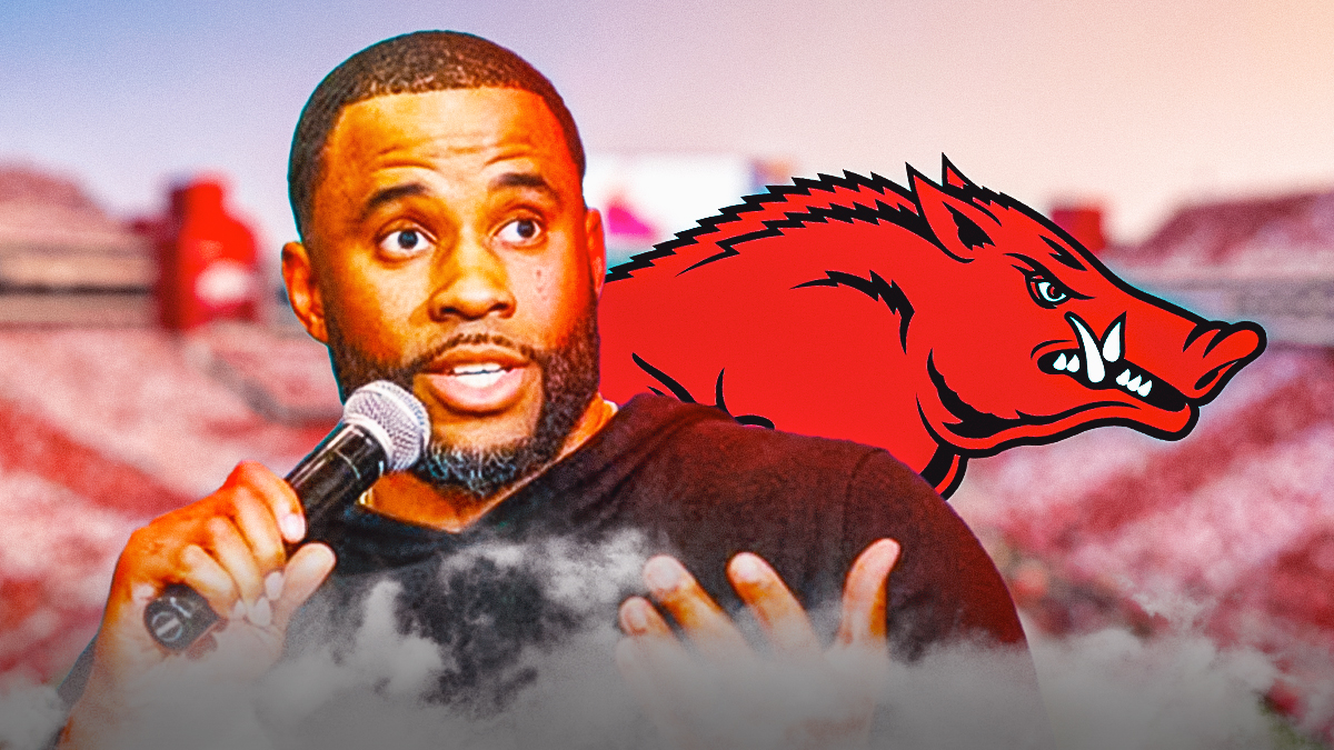 Boston Celtics scouting director Remy Cofield with the Arkansas Razorbacks logo in the background