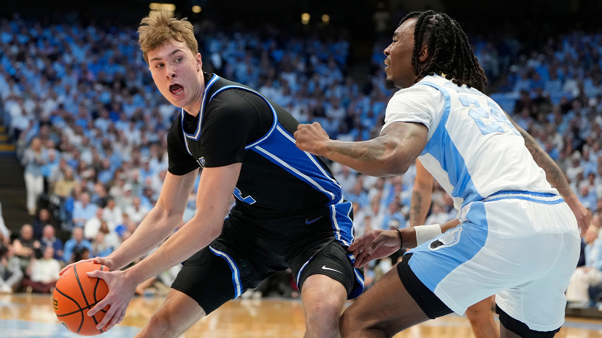 Duke Blue Devils forward Cooper Flagg (2) with the ball as North Carolina Tar Heels forward Jae'Lyn Withers (24) defend in the first half at Dean E. Smith Center.